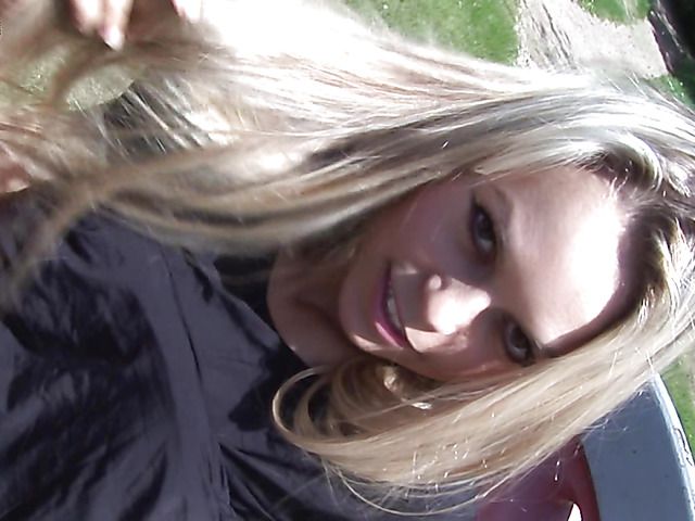 Naughty girl fingers her shaved pussy in the park