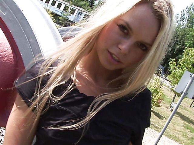 Naughty girl fingers her shaved pussy in the park