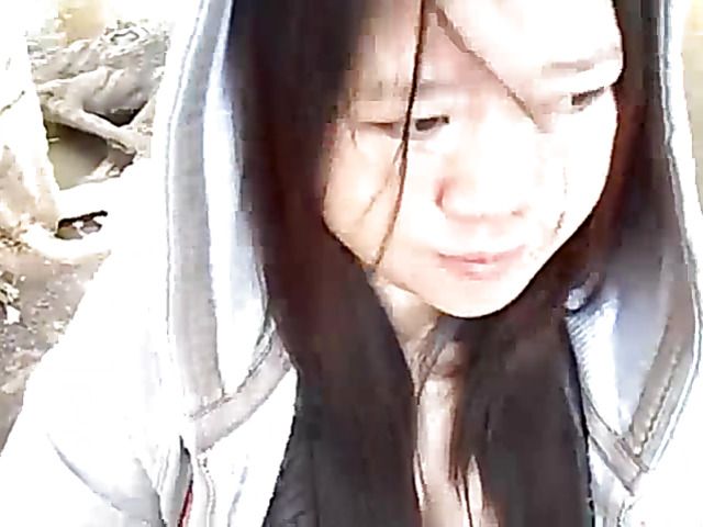 Asian beauty blowing fat dick outside