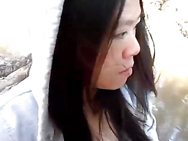 Asian beauty blowing fat dick outside