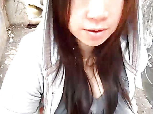 Asian beauty blowing fat dick outside