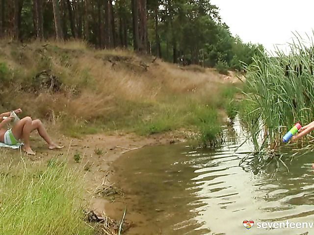 Outdoor sex on the bank of the lake with big titty Rita