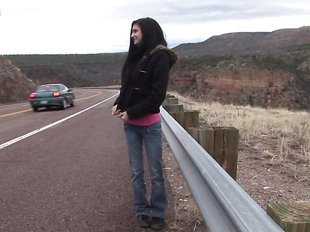 Brunette girl with shaved pussy peeing on the roadside