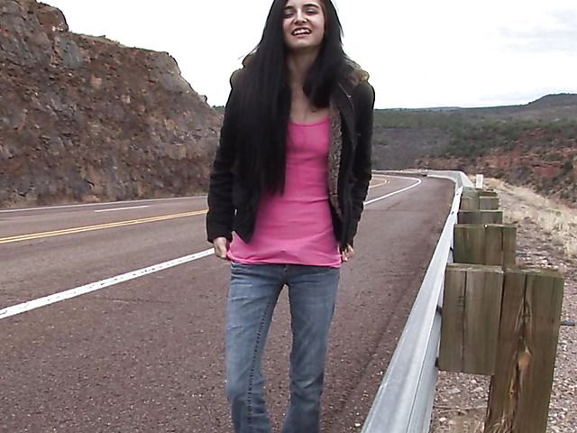 Brunette girl with shaved pussy peeing on the roadside