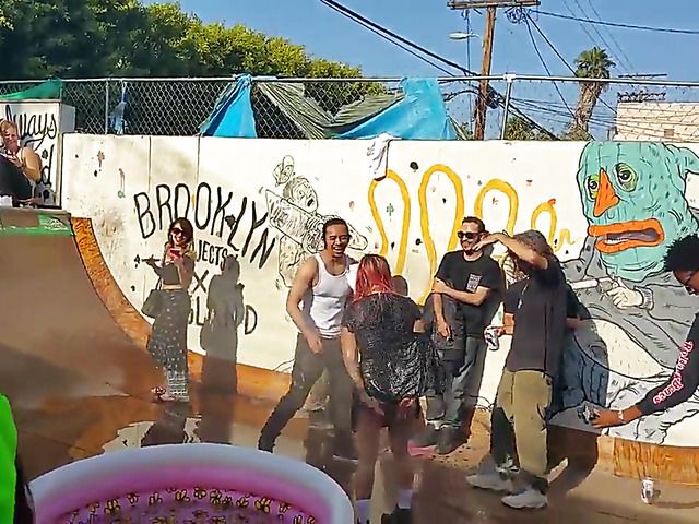 Wet amateur chicks go topless in public