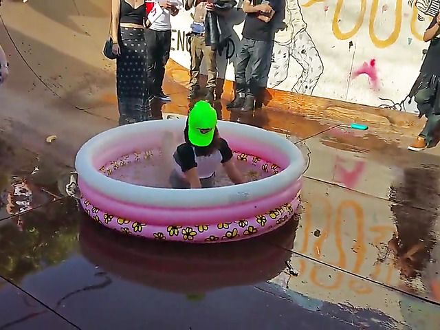 Wet amateur chicks go topless in public