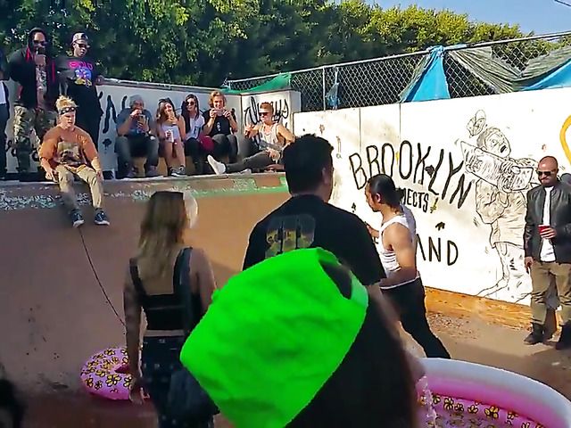 Wet amateur chicks go topless in public