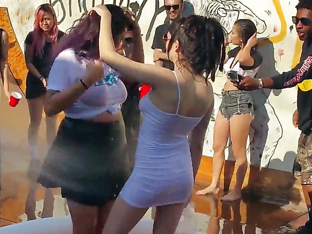 Wet amateur chicks go topless in public