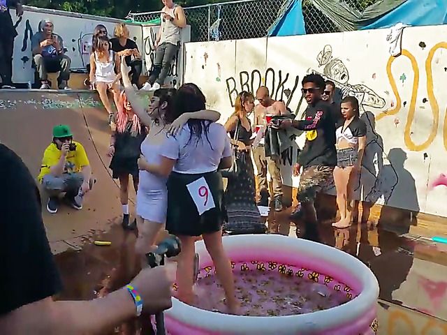 Wet amateur chicks go topless in public