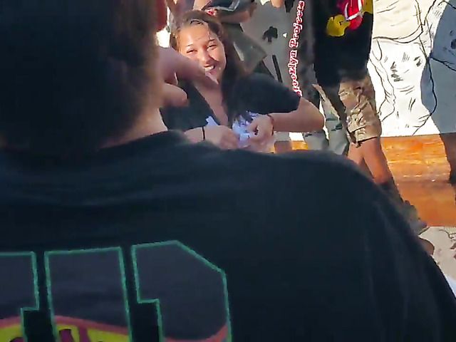 Wet amateur chicks go topless in public