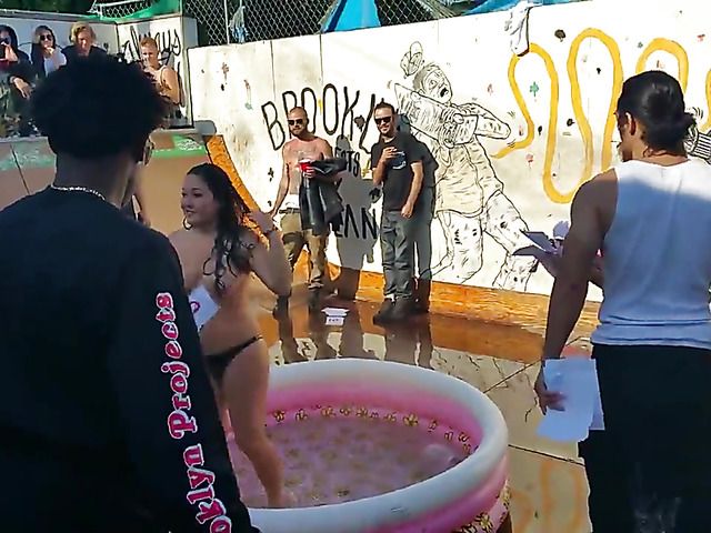 Wet amateur chicks go topless in public