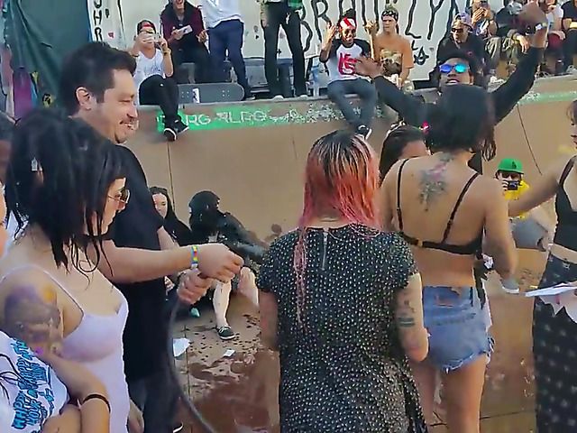 Wet amateur chicks go topless in public