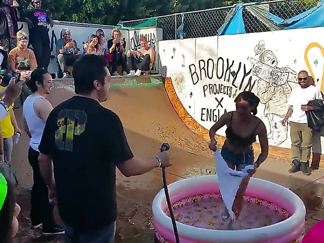 Wet amateur chicks go topless in public