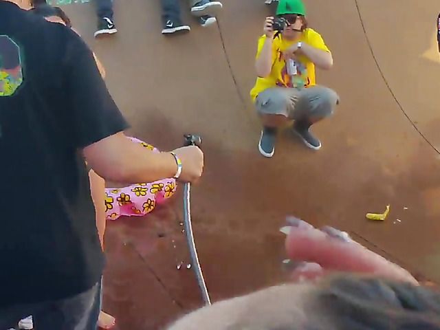 Wet amateur chicks go topless in public