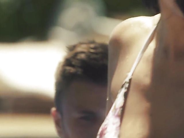 Two sexy babes have a poolside threesome