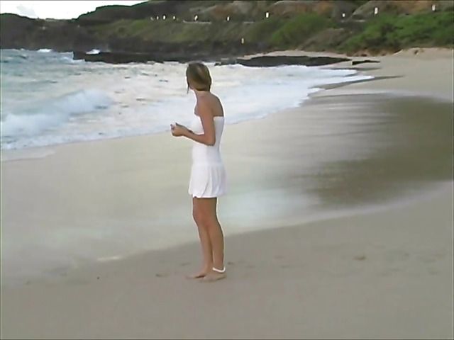 Amateur girl with perfect boobs goes topless on the beach