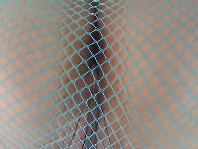 Exotic babe in mesh pantyhose reveals her pussy