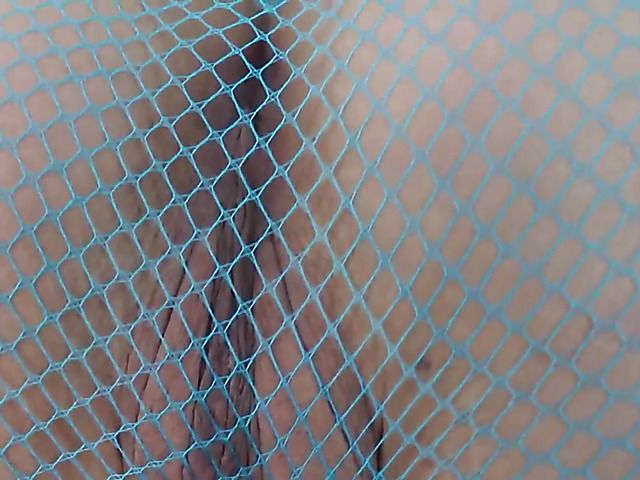 Exotic babe in mesh pantyhose reveals her pussy