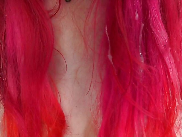 Pink haired slut with pierced tits gives handjob in POV