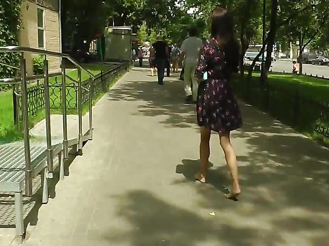 Barefoot amateur with dirty soles in the street