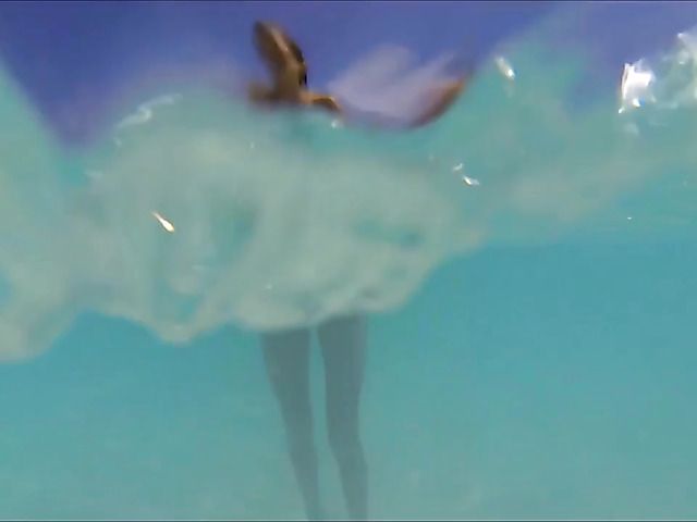 Sexy babe poses naked on the beach and skinny dip