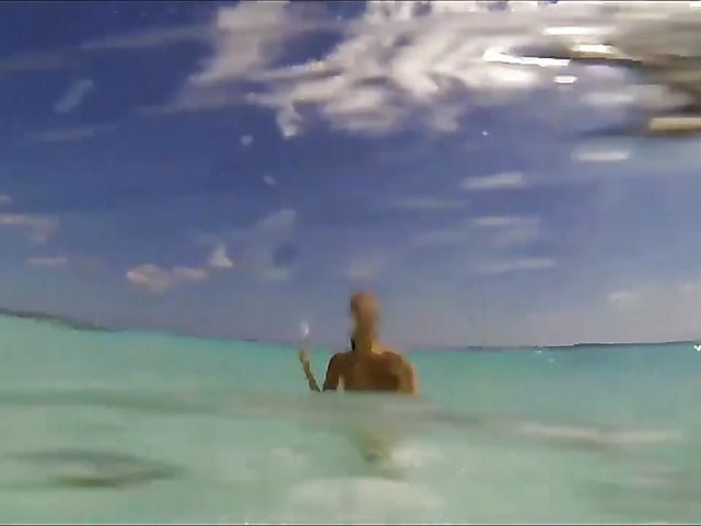 Sexy babe poses naked on the beach and skinny dip