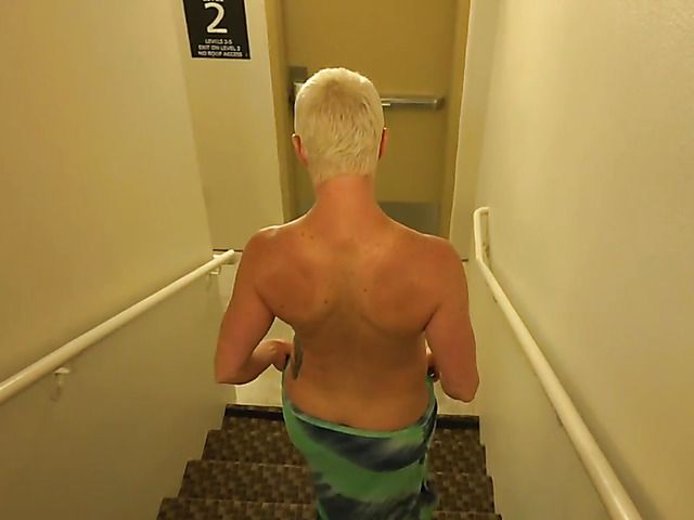 Short haired MILF is proud of her huge boobs