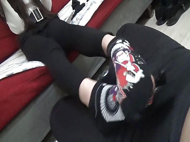 Japanese girl in black socks gives a footjob