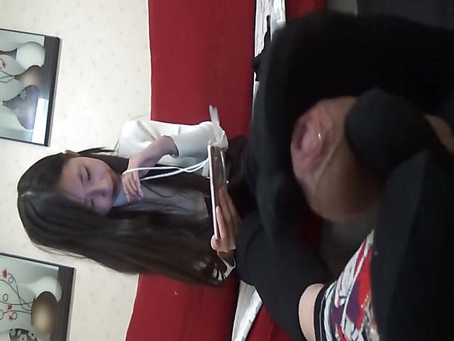 Japanese girl in black socks gives a footjob