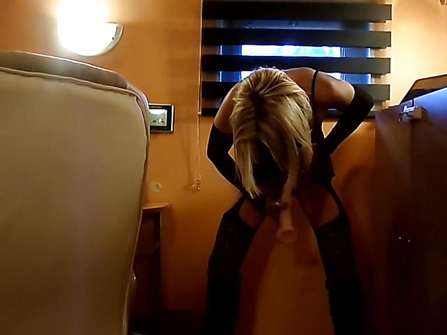 Amateur in stockings toys her hole standing up