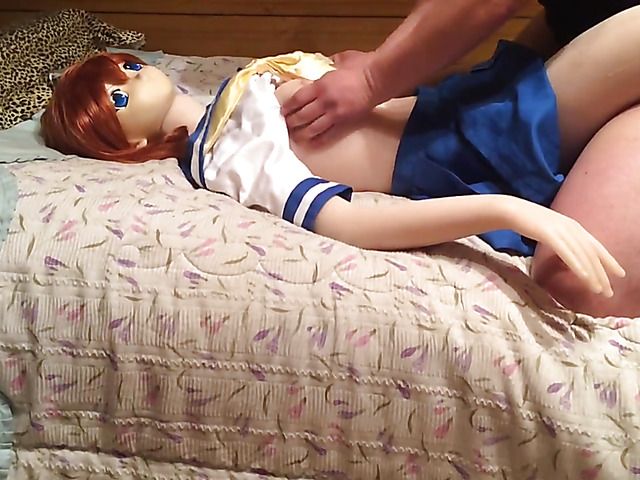 Amateur guy fucks his new red haired sex doll on the bed