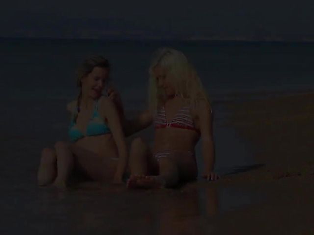 Two playful bikini girls get naked on the beach