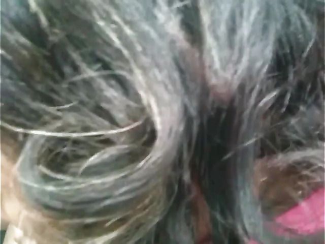 Big breasted amateur giving a car blowjob