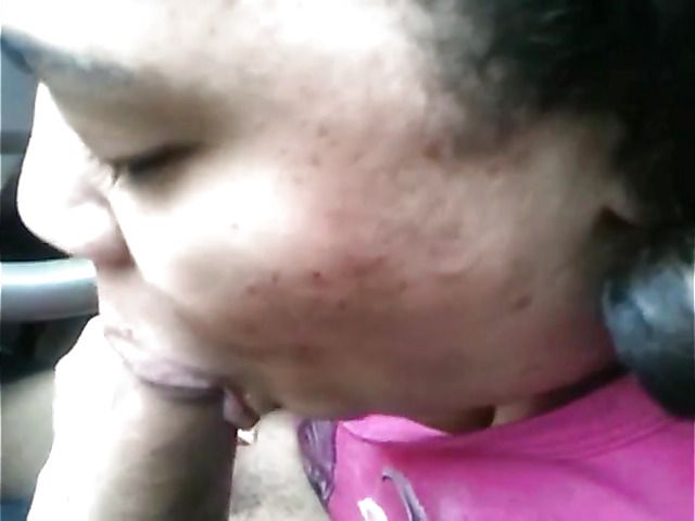 Big breasted amateur giving a car blowjob