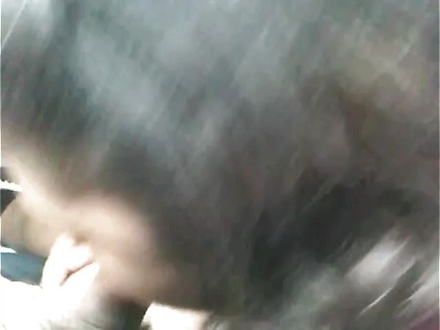 Big breasted amateur giving a car blowjob