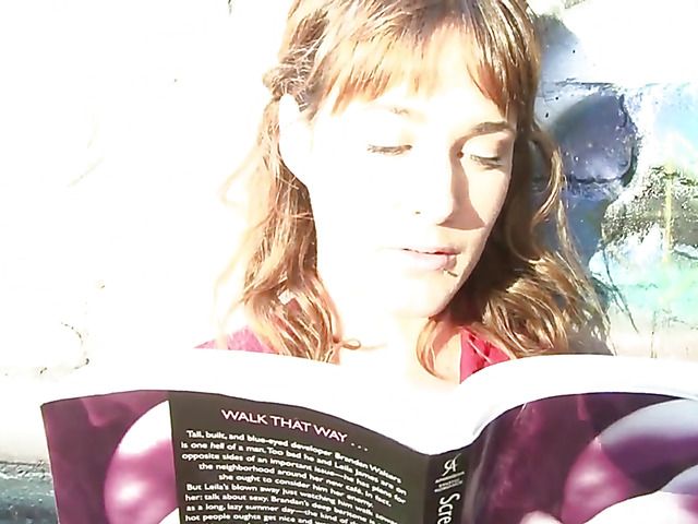 Pretty MILF in red reading and masturbating in public