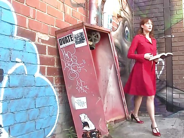 Pretty MILF in red reading and masturbating in public