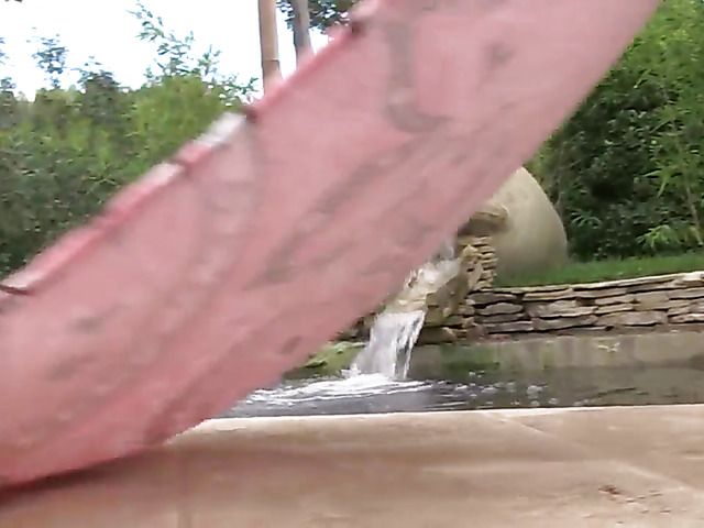 Blonde flaunts her huge natural tits in the pool