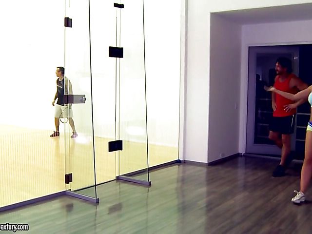 Foot fucking in the gym with a busty bombshell