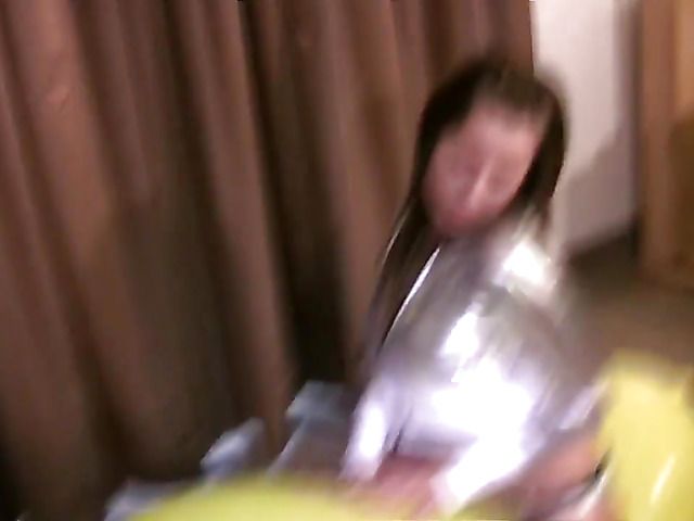 Balloon riding girl in a shiny silver outfit