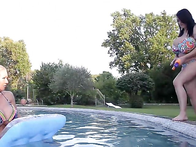 Huge tits women play with water guns topless
