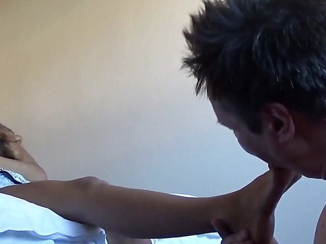 Pretty mistress with hot legs makes slave lick her feet