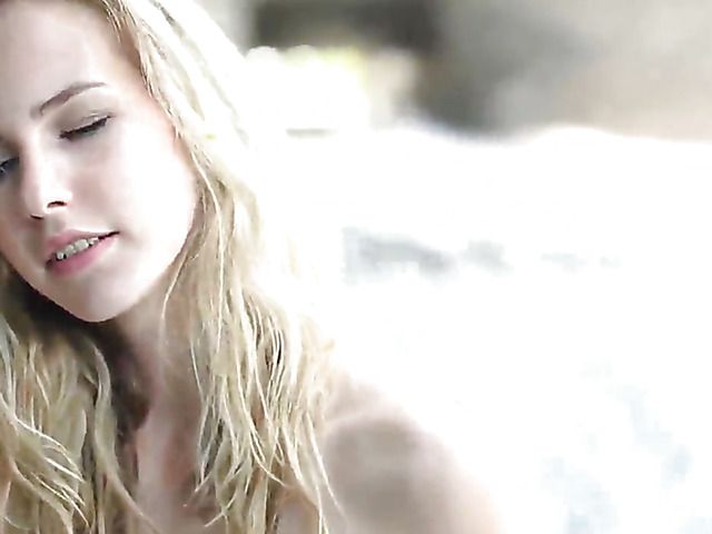 Naked blonde with hairy pussy gets all wet by water