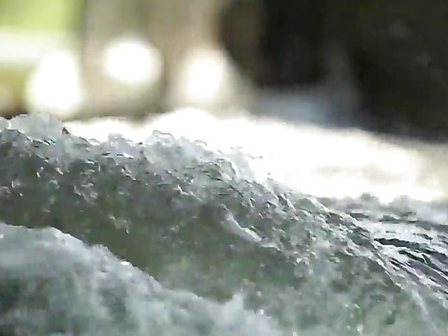 Naked blonde with hairy pussy gets all wet by water