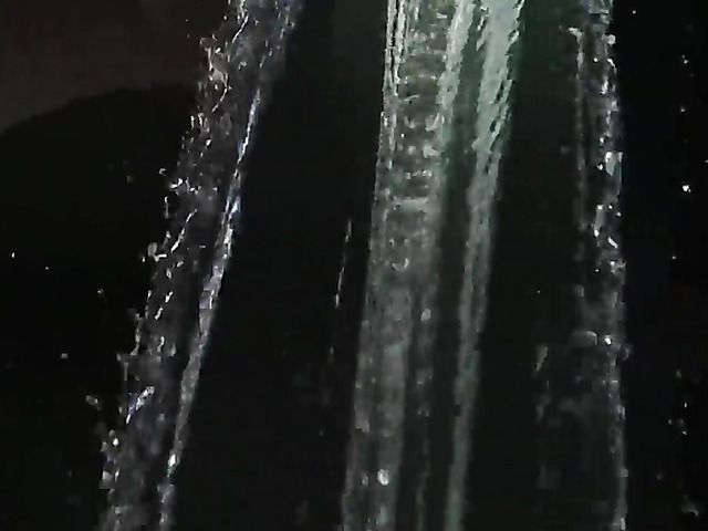 Naked blonde with hairy pussy gets all wet by water