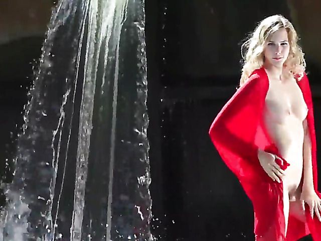 Naked blonde with hairy pussy gets all wet by water
