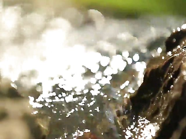 Naked blonde with hairy pussy gets all wet by water