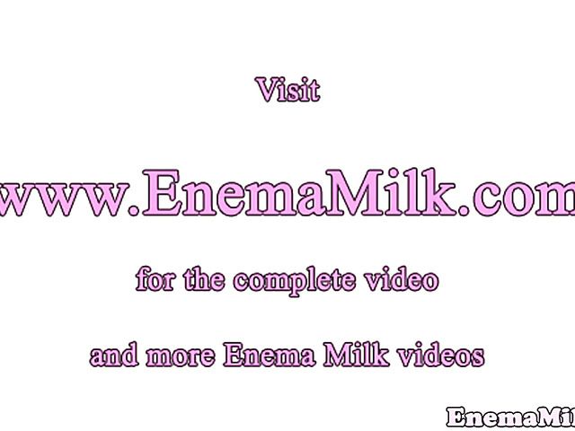 Two naked brunettes play with whipped cream
