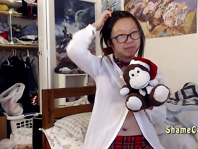 Asian schoolgirl Lily getting naked and masturbating