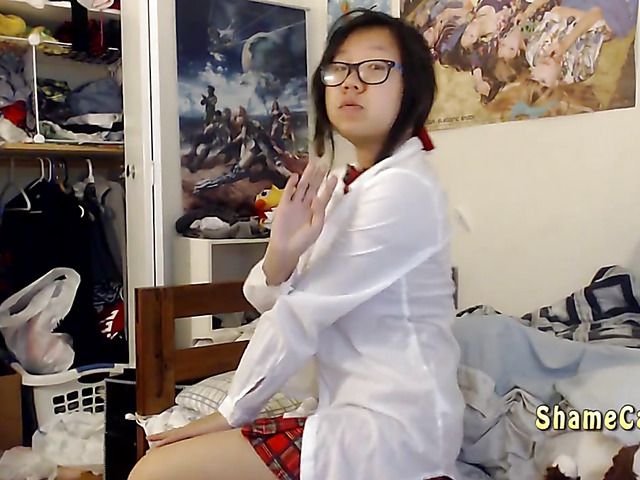 Asian schoolgirl Lily getting naked and masturbating